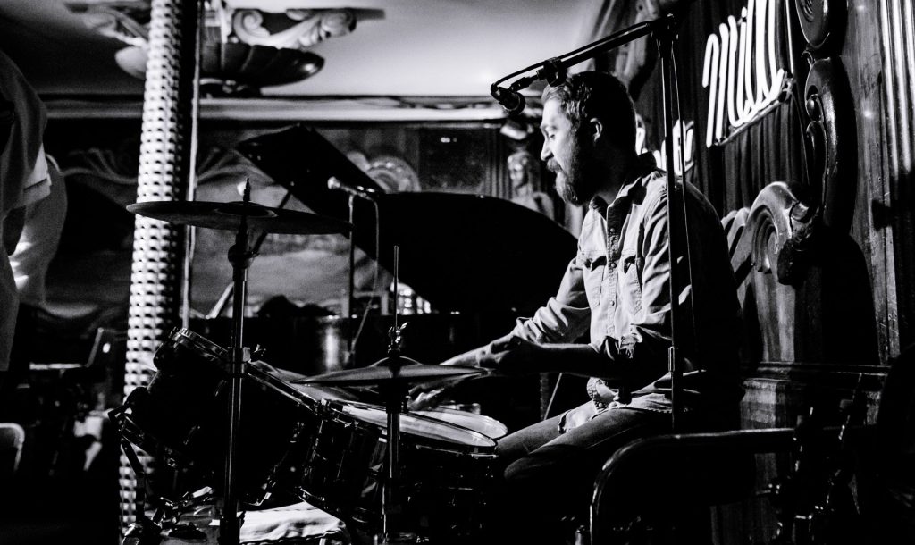 Side view of Danny Lee Beasley playing drums at The Green Mill in Chicago